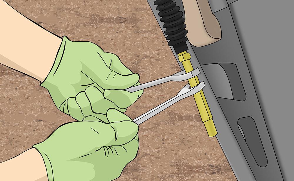 Partie 3 de 5 : Démontage du dispositif de réglage externe du câble d'embrayage